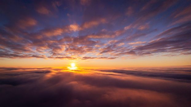 Dramatic drone photo flying high in the clouds
