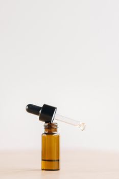 Essential oil in one bottle standing on the surface.