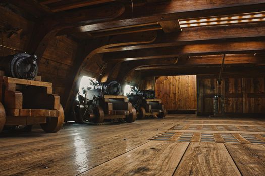 Stockholm, Sweden - February 22 2019: Interior of a gun deck on a historic warship with cannons