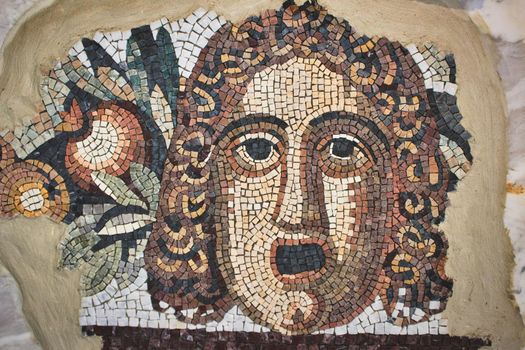 Rabat / Malta - June 28 2019: Ancient mosaic depicting a man's face
