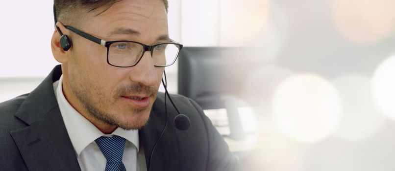 Business people wearing headset working in office to support remote customer or colleague. Call center, telemarketing, customer support agent provide service in broaden view .