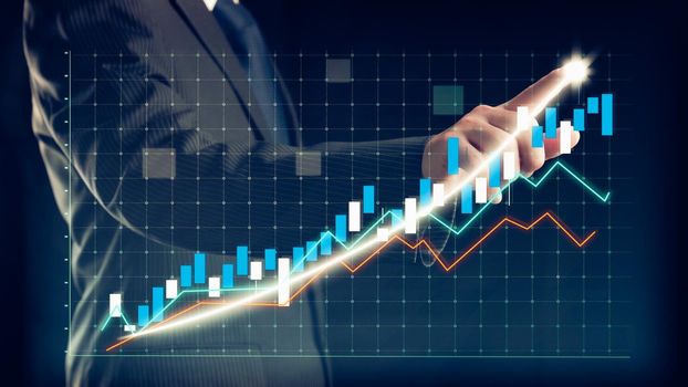 Businessman draw finance allusive graph chart showing business profit growth increasing to future target . Excellent financial status of corporate business rise up . Finance and money technology .