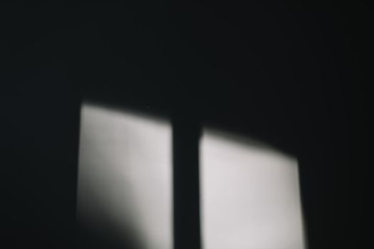 Abstract background with window shadow and sunlight on a white concrete wall. Mockup for presentation, screensaver with reflection and window frame