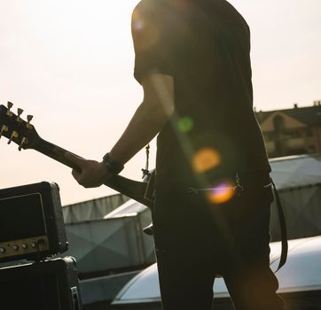 Guitarist playing outdoors