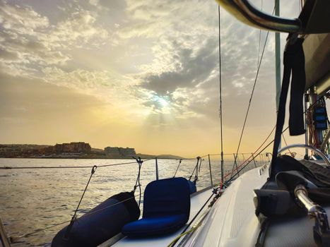 Beautiful sunset from aboard a luxury yacht sailing off the coast in the Mediterranean sea