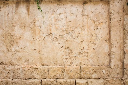 Old weathered stone and plaster square rectangular wall background