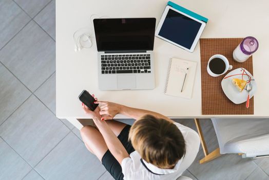 Businesswoman working from home.