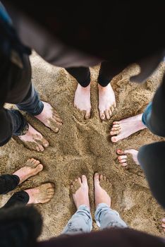 group of friends together on the beach