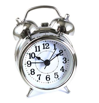Alarm clock with bells and hammer isolated against a pure white background