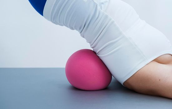 Woman during pilates exercises for the back.