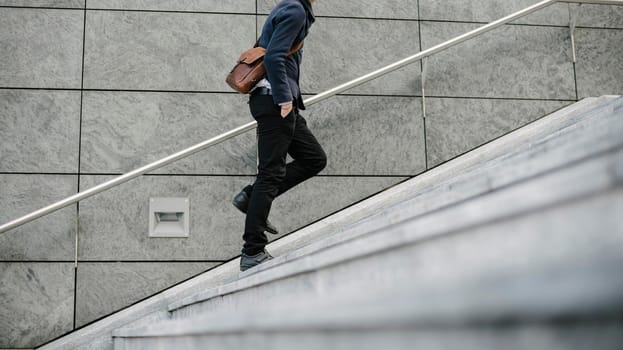 Businessman going to work in the city walking in the street.