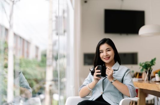 Portrait business asian woman or accountant working computer at office, looking on camera