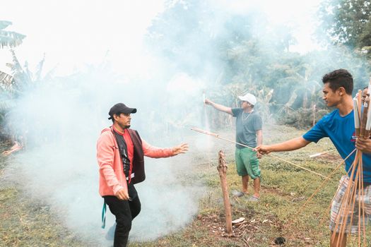 Group of Nicaraguan men launching handmade fireworks during a celebration in Rivas Nicaragua