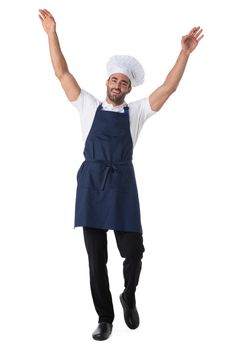 Portrait of happy young cook in uniform standing isolated over white background with arms raised