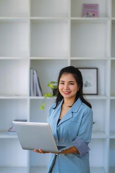 data analysis, budget calculation, research, risk management, portrait of Asian women using computers and financial documents in capital planning to increase company profits.
