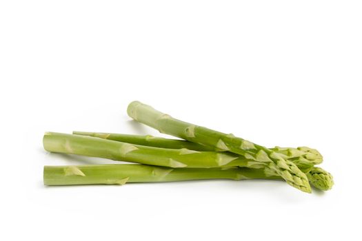 Fresh green asparagus on a white isolated background. Green asparagus isolate with shadow on white background