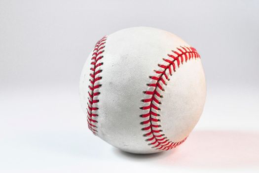 A baseball isolated against a white background