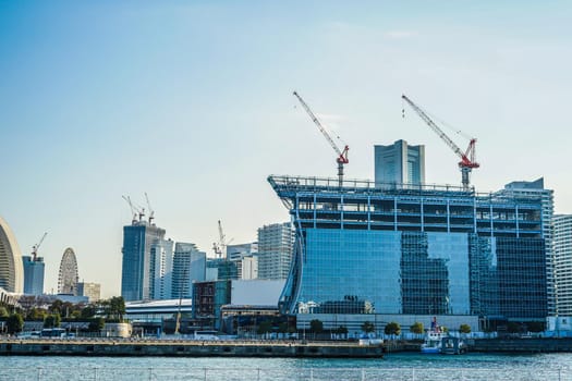 Construction crane and the city of Yokohama Minato Mirai. Shooting Location: Yokohama-city kanagawa prefecture
