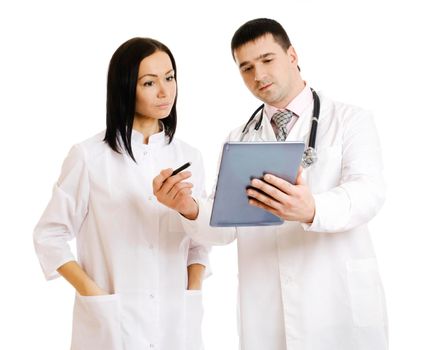 Two cheerful doctors using a digital tablet. Isolated on white