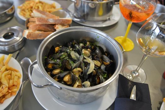 Mussels with french fries and beer in a french restaurant