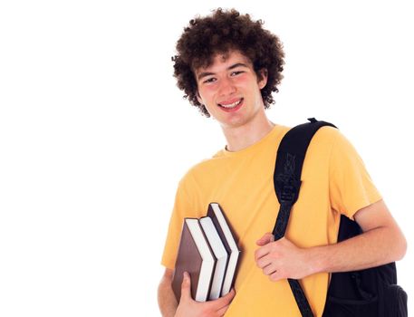 Smiling happy student standing with backpack and books. Isolated on white.