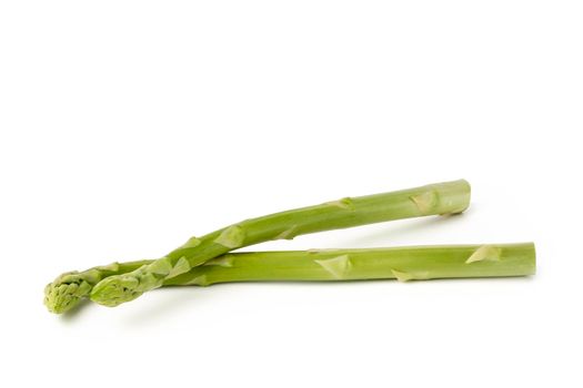 Fresh green asparagus on a white isolated background. Green asparagus isolate with shadow on white background