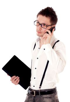 Businessman holding a laptop and calling on a mobile phone. Isolated against a white background.