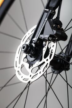 Shiny bicycle brake rotor close-up in macro with selective focus