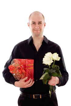 Picture of a young male holding a flower and gift, isolated on white