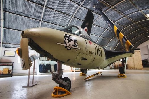 Ta' Qali, Malta - November 04 2020: Royal Air Force Hawker Sea Hawk in the Maltese aviation museum hangar with the wings folded up