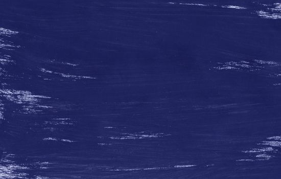 A painted sheet of blue color with a gouache brush. Hand-drawn gouache blue abstract background. Texture of brush strokes.