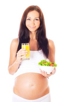 Pregnant woman eating chopped salad, isolated on white.