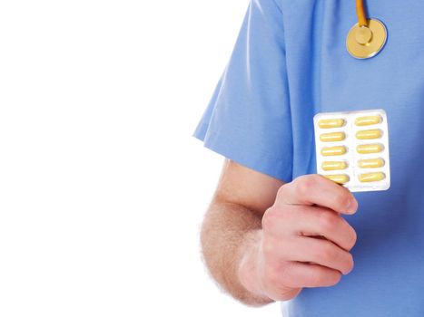 Male doctor wearing lab coat holding medicine, isolated on white background