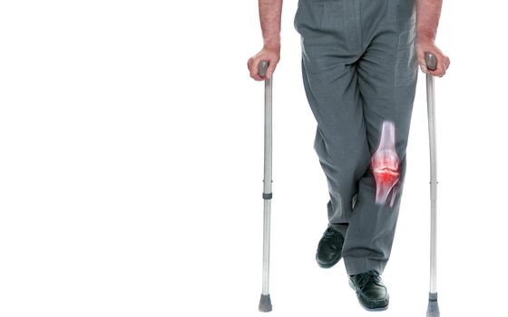 Old Man With Stuff Walking.walking stick or staff cane for patient or Aged Grandfather showing left knee pain isolated on whith background. clipping path.