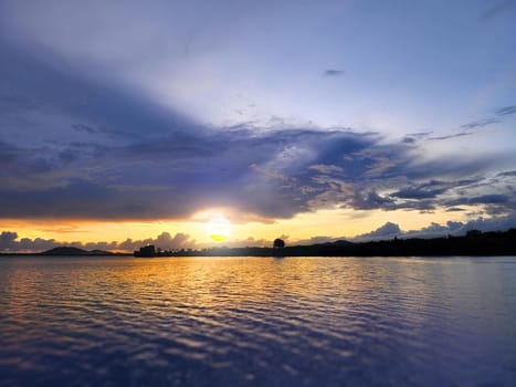 Tropical beach with smooth wave and sunset sky abstract background. Copy space of business summer vacation.