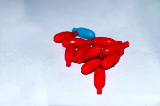 red colored vitamin a capsule stock for kid