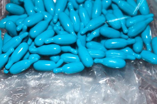 cyan colored vitamin a capsule stock for kid