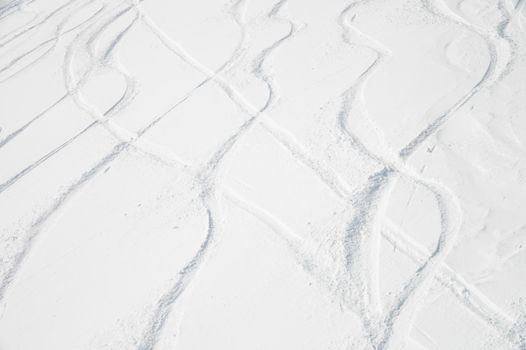 Curly ski trail on the snow in the mountains of Antarctica. Freeride off-piste skiing concept.