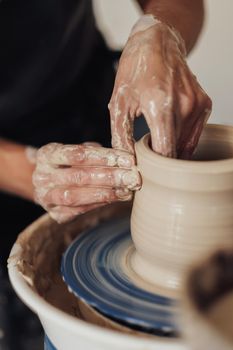 Close Up of Pottery Artist at Work, Potter Master Creating Clay Pot on Wheel