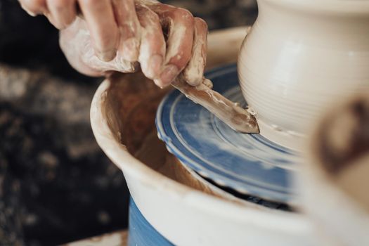 Close Up of Pottery Artist at Work, Potter Master Creating Clay Pot on Wheel