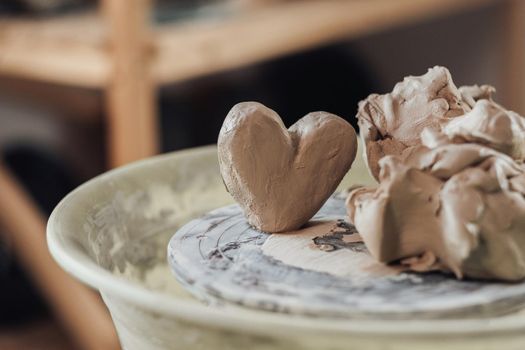 Close Up of Clay in a Shape of Heart on Pottery Wheel