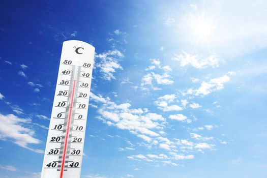 Mercury thermometer. Summer heat or global warming climate change concept.