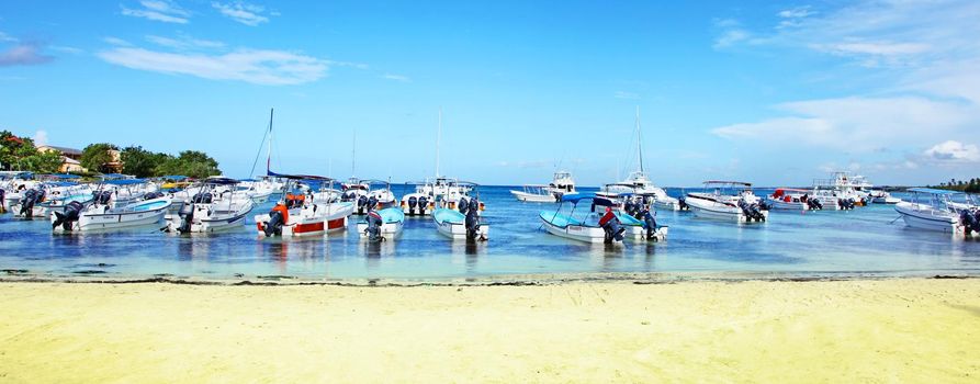 Blue sky and soft sand. Travel and summer vacation background.