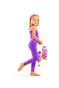 Daughter, posing in studio wearing inline roller skates.