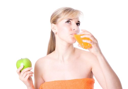 Beautiful woman after bath with orange juice and apple, isolated on white