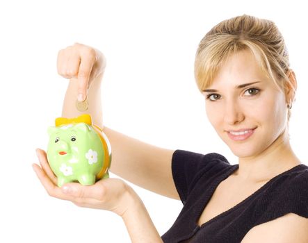 Woman holding piggybank and putting money in it, isolated on white