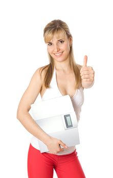 Fit young woman holding a scale, isolated on white