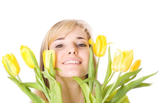 Smiling woman with bouquet of tulips on isolated white