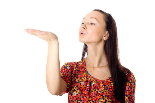 Woman blowing something (what you want) off of her hands