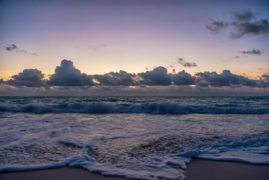 Sunset on the Caribbean Sea. Clear sky with small clouds. Clear weather.